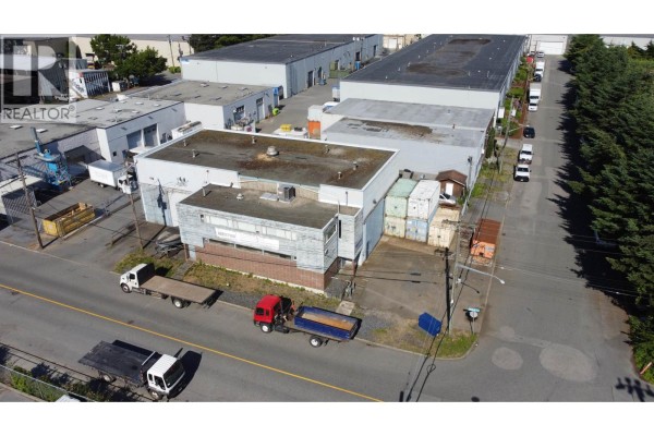 Aerial view of commercial property with trucks and neighbouring industrial buildings. - 1514 Bay Street, North Vancouver