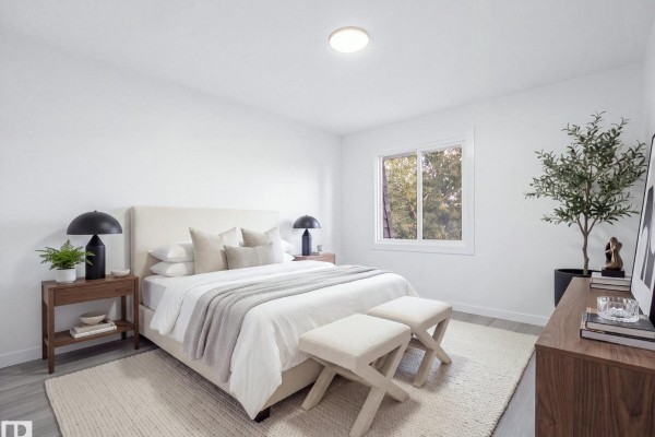 Interior view showing hallway, stairs, and entrance to a modern kitchen area. - 152 Londonderry Square Sq Nw, Edmonton