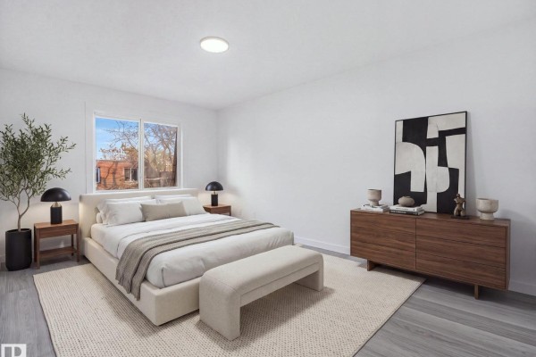 Kitchen with white cabinets, stainless steel refrigerator, oven, and microwave. - 152 Londonderry Square Sq Nw, Edmonton