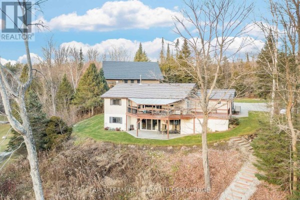 Multi-level home with deck and walk-out basement on wooded lot - 1520 Rosemount Road Tay