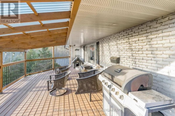 Covered deck with grill and seating - 1520 Rosemount Road Tay