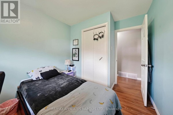 Bedroom with bed, closet, and hallway view - 15253 County Road 2 Road South Stormont