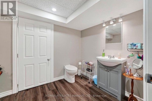 Renovated bathroom with sink, vanity, toilet, and mirror - 15253 County Road 2 Road South Stormont