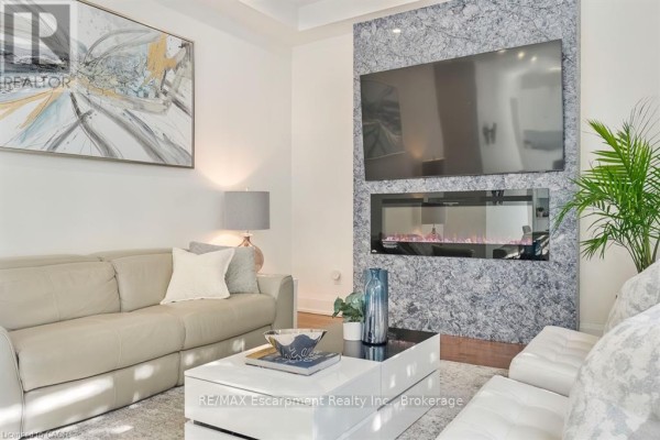 Modern home with stone and wood exterior, double garage, and large windows - 1526 Bridge Road Oakville