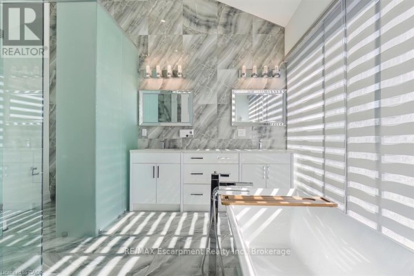 Freestanding tub and marble tile shower - 1526 Bridge Road Oakville