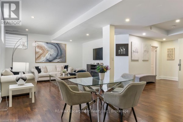 Home office with desk, keyboard, guitars, and vaulted ceiling - 1526 Bridge Road Oakville