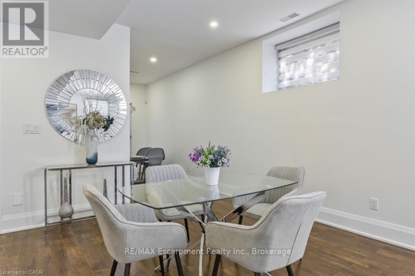 Floating staircase with glass railings and hardwood floors - 1526 Bridge Road Oakville