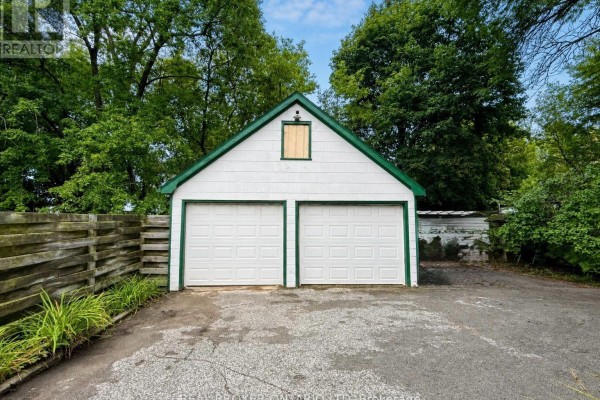 Exterior of a detached two-car garage with white doors. - 153 Hale Street, London East