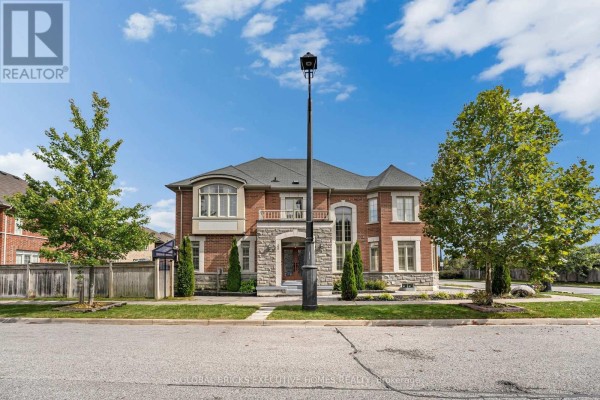 Front exterior of a two-story brick house with stone accents and a covered entryway. - 1534 Scenic Lane Drive, Pickering
