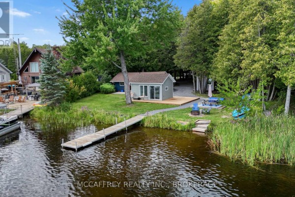 Wide aerial view of Beaver Lake with forested shorelines and a clear blue sky. - 154 A/b North Beaver Lake Road, Stone Mills