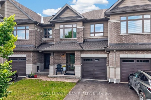 Dark wood kitchen cabinets with granite countertops, stainless steel appliances, and a subway tile backsplash. - 154 Woodhurst Crescent, Ottawa