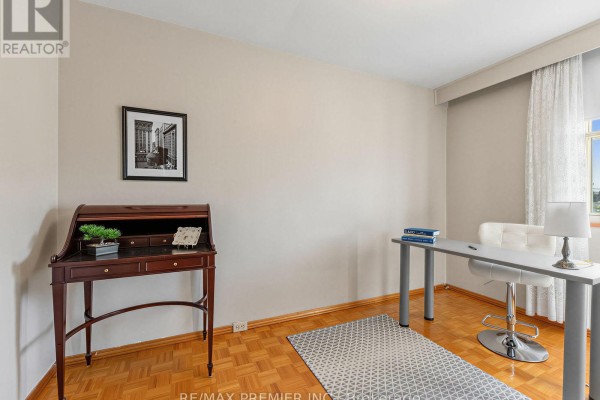 Secretary desk, modern desk, office chair, and patterned rug in office - 155 Ascot Avenue Toronto