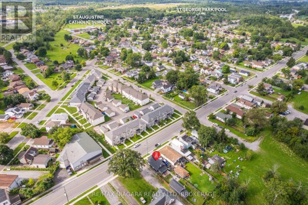 Aerial view of residential neighborhood with townhouses and homes near St. Augustine School - 155 Broadway Street Welland