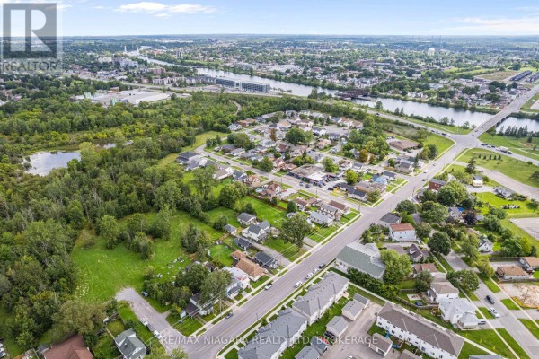 Aerial view of suburban neighborhood with river and bridge - 155 Broadway Street Welland