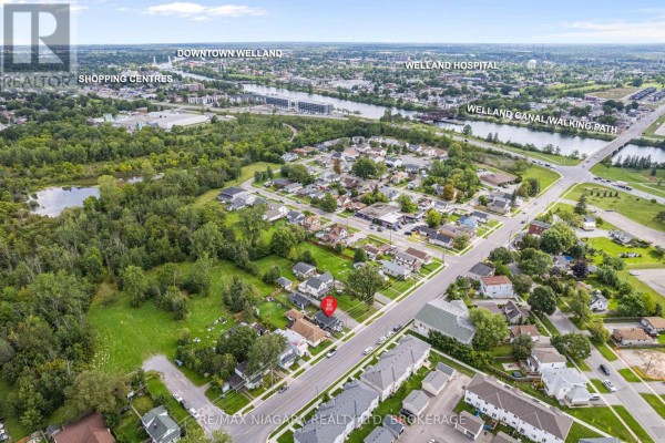 Aerial view of neighborhood with homes, canal, and walking path - 155 Broadway Street Welland