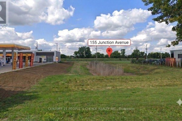 View of McDonald's and Shell gas station from across the street with trees. - 155 Junction Avenue, Chatham Kent