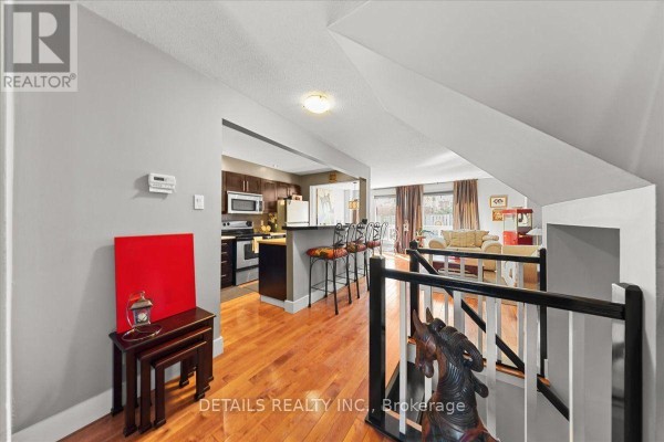 View from hallway looking into open-concept kitchen and living area. - 156 Birch Hill Private N, Ottawa