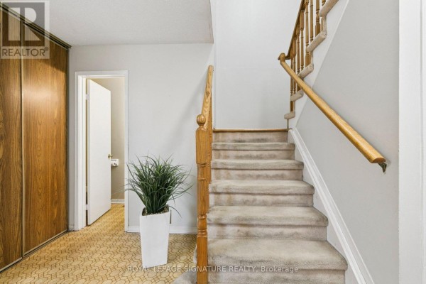 Corner living room with parquet flooring and a bay window. - 156 Macedonia Crescent, Mississauga