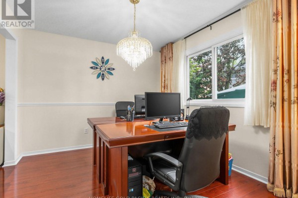 Office with wooden desk, computer, chandelier, and hardwood floors - 156 Ravenscroft Road Ajax