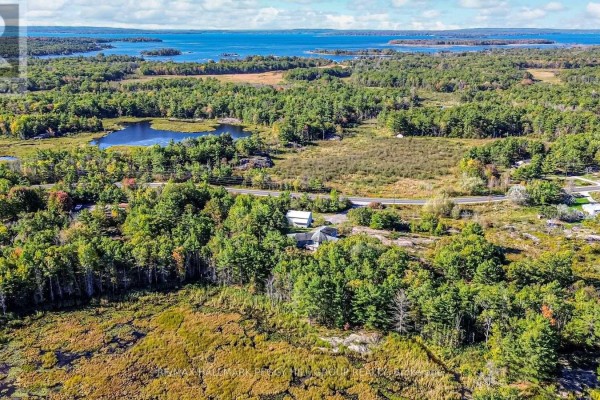 Aerial view of Georgian Bay with water, islands, and wooded areas - 1564 Honey Harbour Road, Georgian Bay