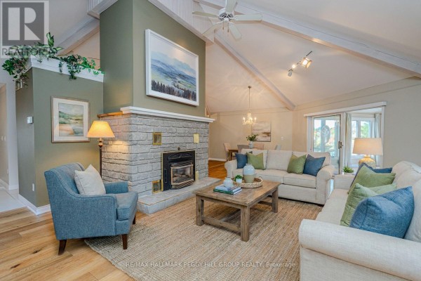 Detached garage with snow-covered ground and house in the background - 1564 Honey Harbour Road, Georgian Bay