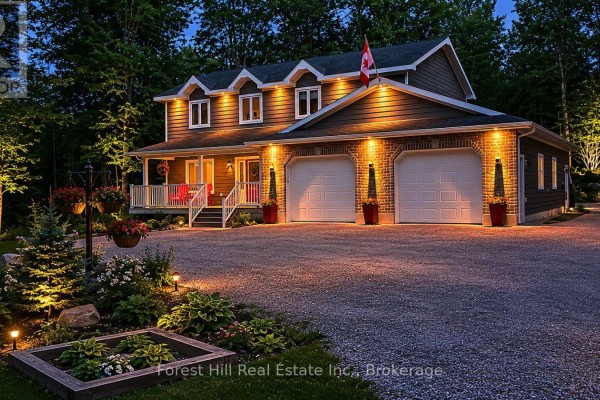 Backyard view of a multi-level home with a patio, deck, and multiple seating areas. - 157 Glen Fiddish Road, West Grey