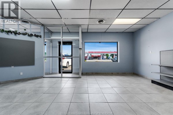 View of commercial interior featuring a glass entryway and window with street visibility. - 1571 Seacliff Drive Unit# 3, Kingsville