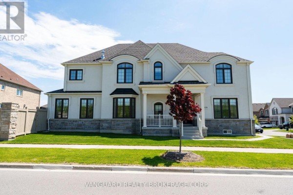 Front exterior of a large residential home with arched windows and stone detailing. - 158 Scarlet Way, Bradford West Gwillimbury