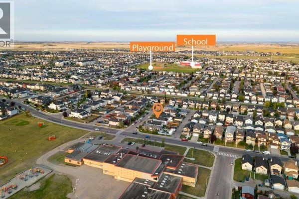 Aerial view of a residential neighborhood with a school and playground labeled. - 158 Taralea Circle Ne, Calgary