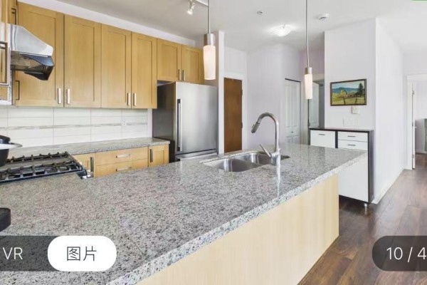 Kitchen with granite countertops, double sink, stainless steel appliances, and light wood cabinets. - 15918 26 Avenue, Surrey
