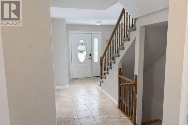 View of front door and staircase with tiled flooring - 1593 Murphy Road, Sarnia