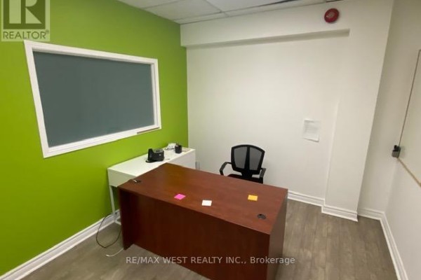 Private office with a desk, office chair, and a large green wall with a whiteboard. - 16 - 500 Alden Road, Markham