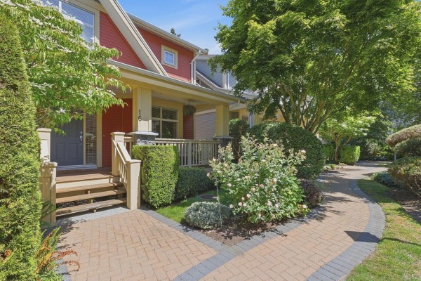Porch with two chairs and a table, overlooking a tree-filled backyard. - 16 15255 36 Avenue, Surrey