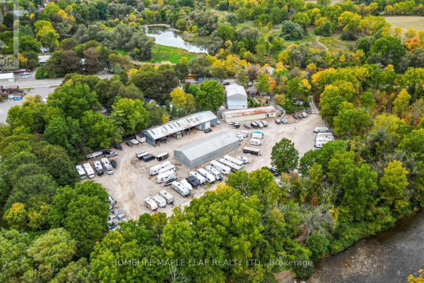 Aerial perspective of the commercial lot at 16 Adamson Street, filled with RVs, trucks, and storage buildings. - 16 Adamson Street, Halton Hills