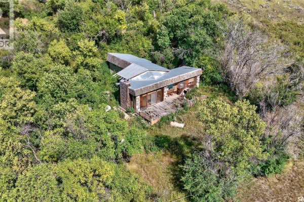 Overhead view of a rustic house with a peaked metal roof and large windows. - 16 Alice Crescent, North Grove