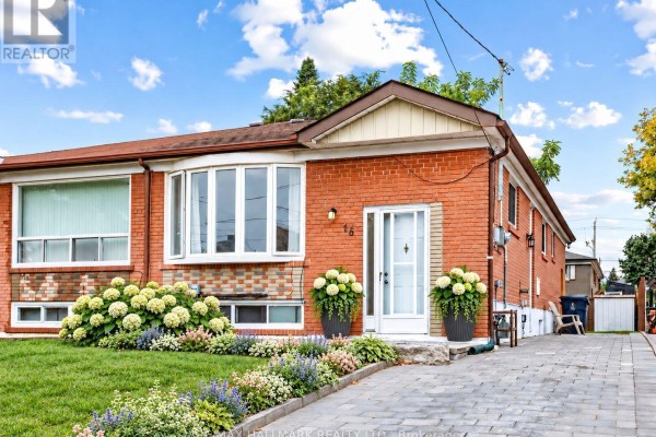 Side view of a brick bungalow with a paved driveway and garden. - 16 Avis Crescent, Toronto