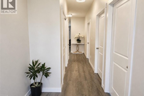 Interior entryway featuring a front door with glass panel and neutral wall colors. - 16 Brookfield Lane, Simcoe