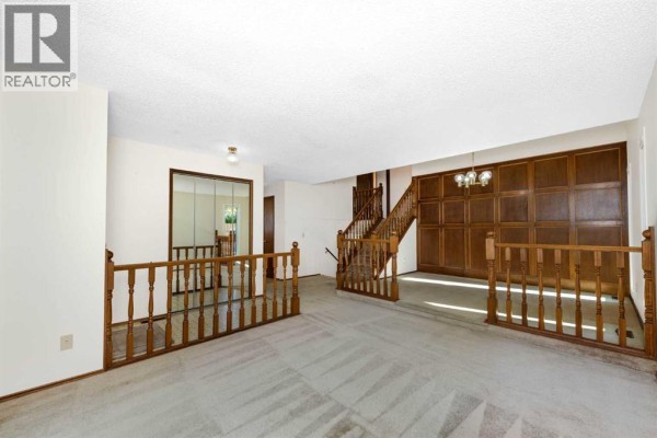 Living room - 16 Deersaxon Circle Se, Calgary, AB T2J6R5 Photo 5