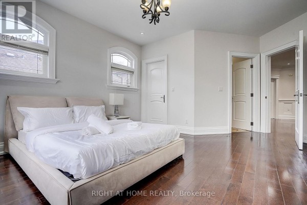Spacious bedroom with king bed, arched windows & hardwood floors - 16 Fairview Avenue Richmond Hill