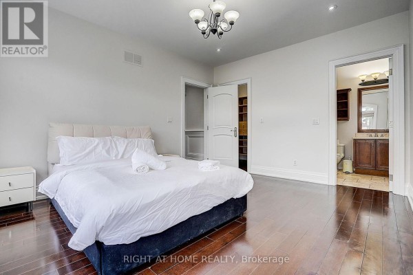 King size bed and ensuite bathroom visible in spacious bedroom - 16 Fairview Avenue Richmond Hill