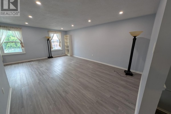 Kitchen with light blue cabinets, white countertops, and mosaic tile backsplash. - 16 Nortonville Drive, Toronto