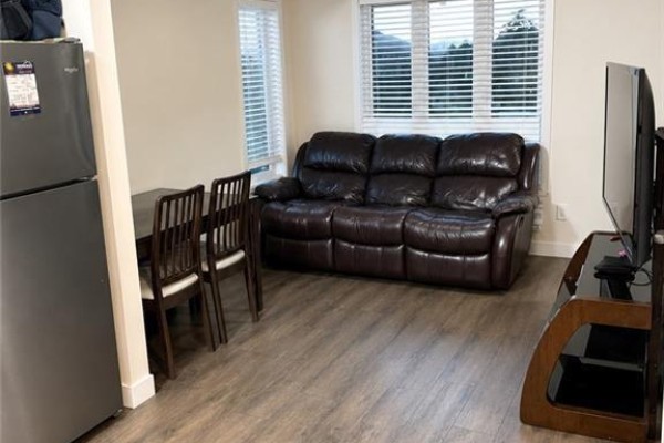 Corner kitchen with grey wood cabinets, granite countertops, and stainless steel appliances. - 160 Rochefort Street Unit# C14, Kitchener