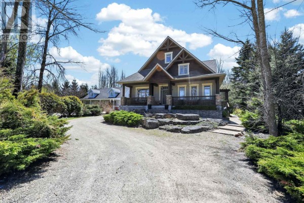 Exterior of a house with a driveway and snow patches. - 160 Sunset Boulevard, Blue Mountains