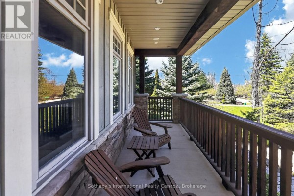 Wooden deck on a covered porch with a view of a garage. - 160 Sunset Boulevard, Blue Mountains