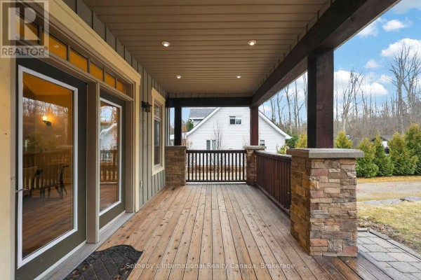 Covered porch with stone pillars and wooden deck - 160 Sunset Boulevard Blue Mountains