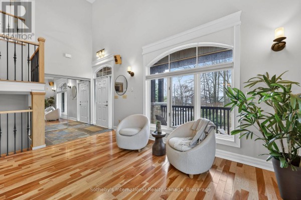 Bathroom with a vanity, toilet, and a window overlooking trees. - 160 Sunset Boulevard, Blue Mountains