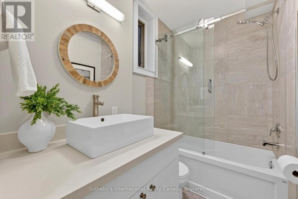 Modern bathroom with vessel sink, wood mirror, and glass shower - 160 Sunset Boulevard Blue Mountains
