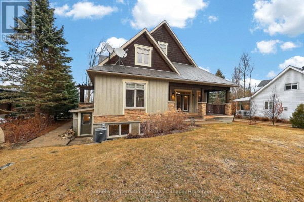 House with covered porch and stone/wood siding - 160 Sunset Boulevard Blue Mountains
