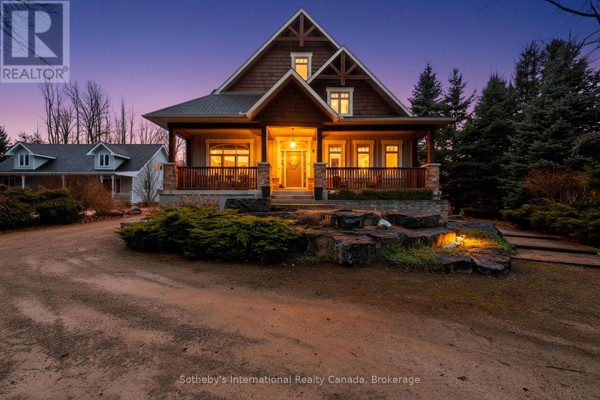 Covered front porch with stone landscaping and gabled roof - 160 Sunset Boulevard Blue Mountains