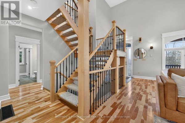Wooden staircase with wrought iron railing and carpeted treads - 160 Sunset Boulevard Blue Mountains